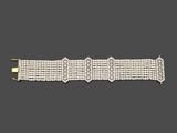 un bracelet en diamants, signé Cartier