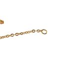 a gold chain with a cross on it on a white background