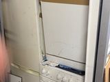 a white refrigerator and a white stove in a room