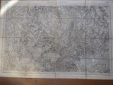 an old map of the united states of america on a wooden table