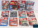 a lot of toy cars that are sitting on a table