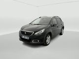 a black car parked in a white room with a white floor