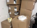 many boxes stacked on top of each other in a room