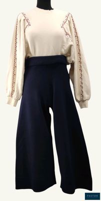 an image of a woman ' s top and pants on a mannequin