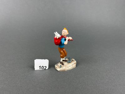 a close up of a figurine of a man on a skateboard