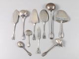 a lot of silver spoons and spoon spoons on the table