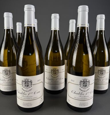 six bottles of wine are lined up in a row on a table