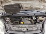 the engine of a car with its hood open and the hood open