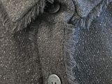 an image of a close up of a button on a jacket