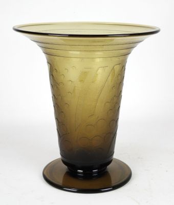 a glass vase that is sitting on a table