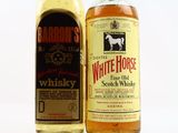 two bottles of white horse whisky next to each other