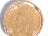 a gold coin in the shape of a sunburst