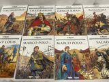 six livres posés sur un lit, avec un drap blanc devant eux