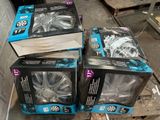 three boxes of rims sitting on the floor next to each other