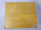 the back of a box with a yellow label on it