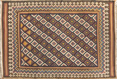 an old rug with a geometric design on it