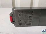 a close up of a battery on a white surface
