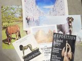 a bunch of books on a table with pictures on it