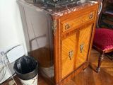 an old typewriter sitting on top of a wooden table
