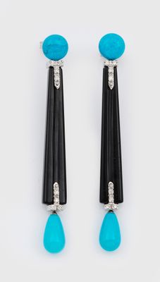 une paire de boucles d'oreilles noires et turquoise ornées d'un pendentif en forme de larme