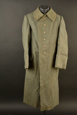 an image of a green coat on a mannequin mannequin