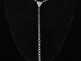 a necklace with a chain and a blue bead hanging from it