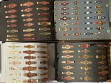 several different types of cigars are lined up on a bed
