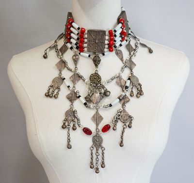 a close up of a mannequin with a necklace on it