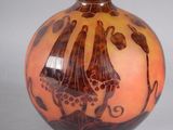 a vase that has a picture of a boat on it