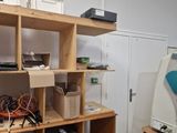 a room with a bunch of boxes and a printer