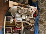 many bowls and pans that are sitting on the floor