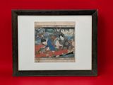 a framed picture of a group of people sitting on a red surface