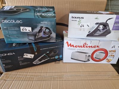 several boxes of vacuums are stacked on top of a cardboard box