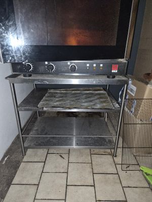 a television sitting on a metal stand in a room
