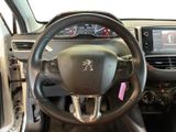 the interior of a car with a steering wheel and dashboard controls