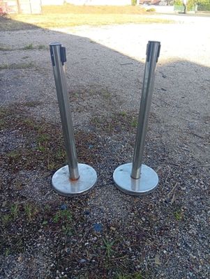 two poles on the ground next to each other