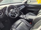 the interior of a car with black leather seats and a steering wheel