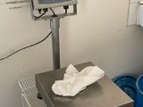 an image of a scale in a room with a lot of trash
