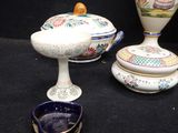 many different types of vases and bowls on the table