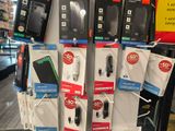 many different types of cell phones on display in a store