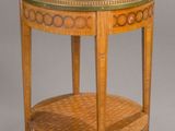an image of a round table with a shelf on top of it