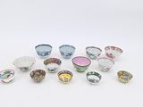 a lot of bowls that are sitting on a table