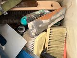 a box full of tools that are sitting on the floor