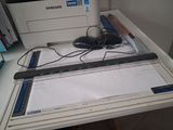 a picture of a desk with a printer and a mouse on it