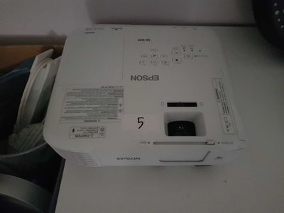 a small projector sitting on top of a white table