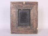an old wooden picture frame with a black chalkboard in it