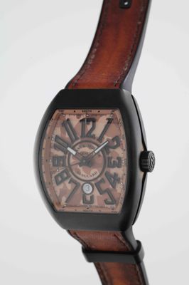 an image of a close up of a watch on a white surface