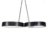 a pair of black pendant lights hanging from a ceiling