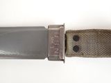 a close up of a knife on a belt