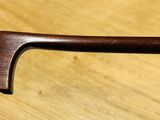 a close up of a handle on a wooden table